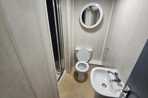 A clean and modern bathroom featuring a sink, t...