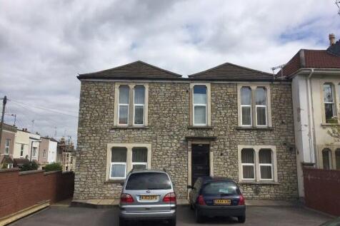 Stone-fronted terraced house with a pitched roo...