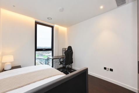 Tidied bedroom with crisp white bedding.png