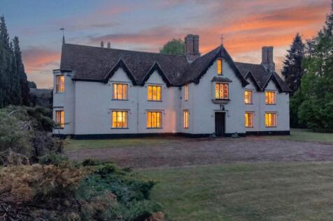 The Priory Suffolk front elevation at twilight wit