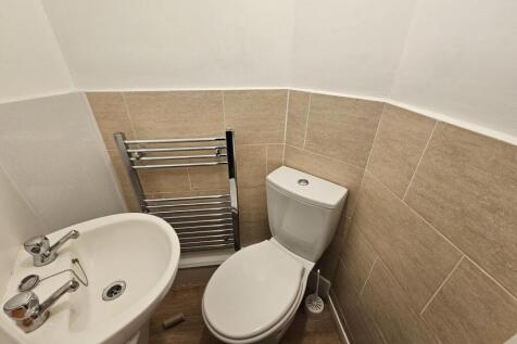 Neat and modern cloakroom with a compact toilet...
