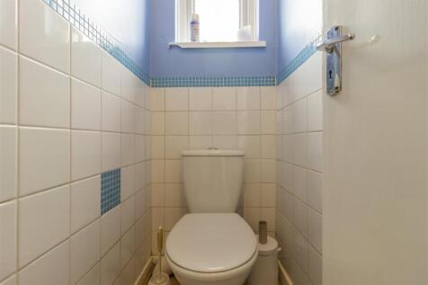 Bright and tidy separate toilet with window...