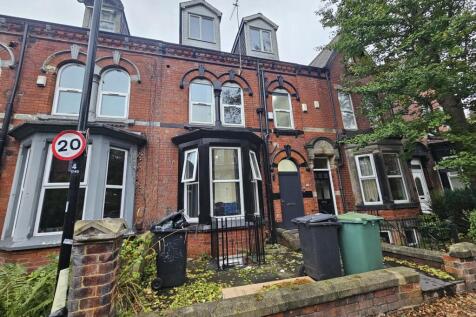 A charming brick-fronted house with classic arc...
