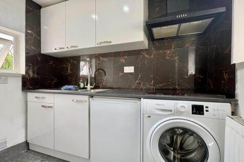 Sleek modern kitchen with built-in appliances...