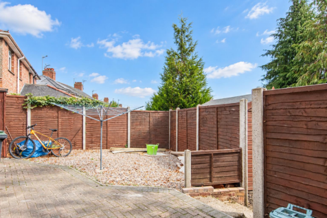 Sunny garden with bicycle and washing line.png