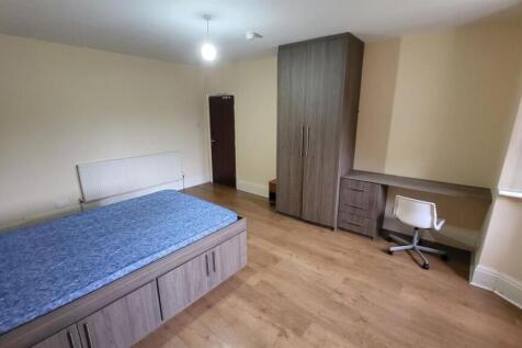 Bright, well-maintained bedroom featuring built...