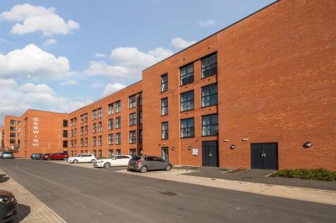 Modern brick apartment building on a sunny day...