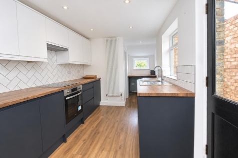 Bright Modern Navy and White Galley Kitchen.png