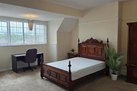 Spacious master bedroom with dedicated study ar...