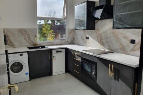 Sleek modern kitchen with integrated appliances...