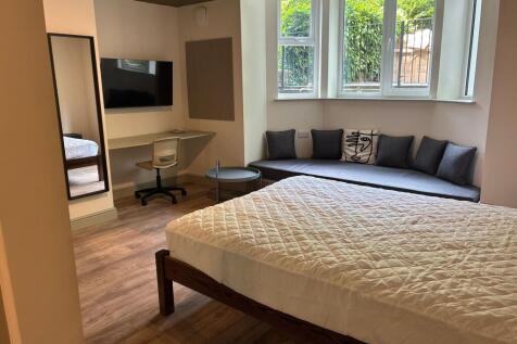 Bright bedroom with stylish window seating area...