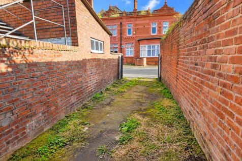 Sunlit Victorian Brick Passage
