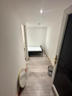 Bright bedroom with modern wood-effect flooring...