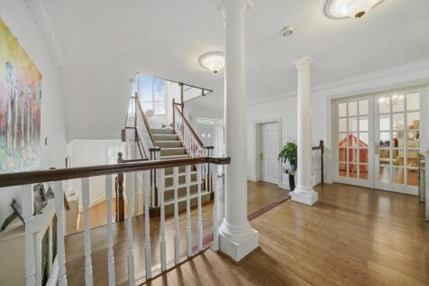 Grand open hallway with elegant pillars...
