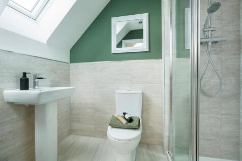 The main bedroom boasts its own en suite shower room