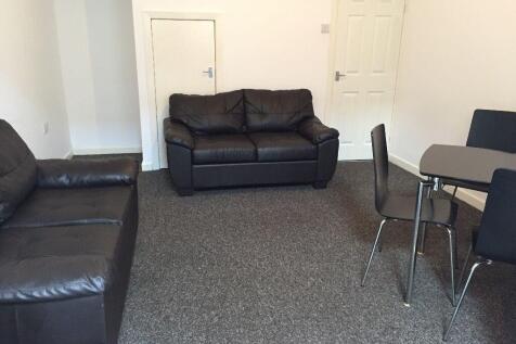 Spacious lounge with leather seating and dining...