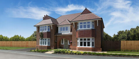 A large detached brick house with bay windows, a front door under an archway, and a well-maintained