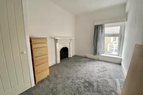 Bright bedroom with character fireplace...