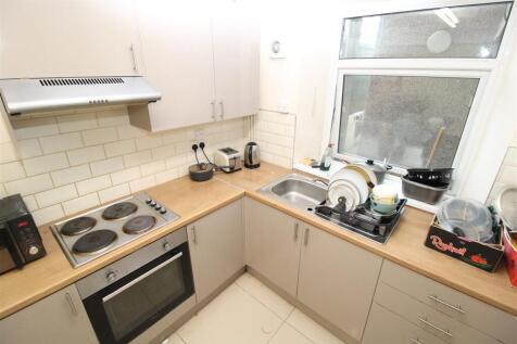 Bright kitchen with modern integrated appliance...