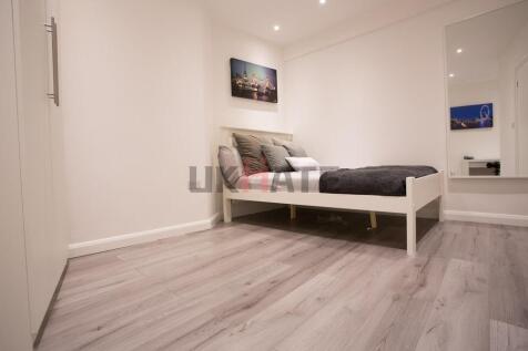 Bright and modern single bedroom featuring a co...