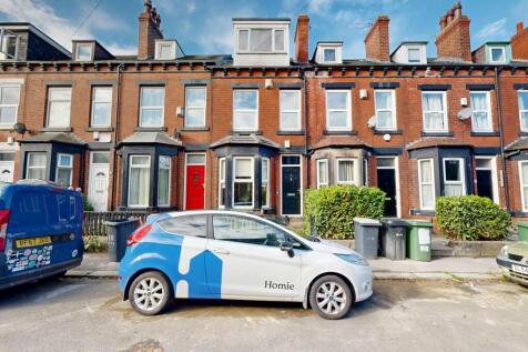 A charming front view of a traditional terraced...