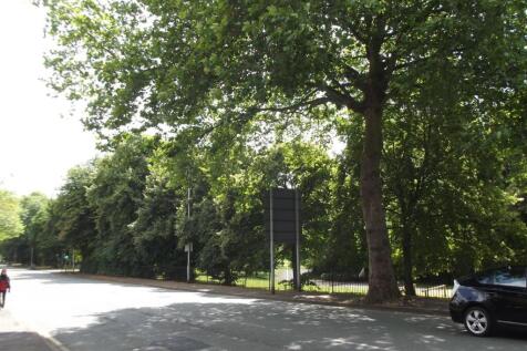 Tree-lined street with ample roadside parking a...
