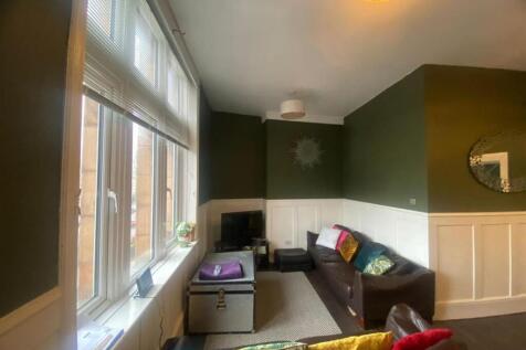 Warm, well-appointed living room with a large b...