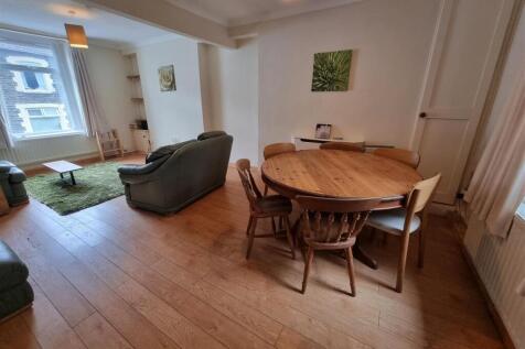 Bright open-plan lounge with large dining area...