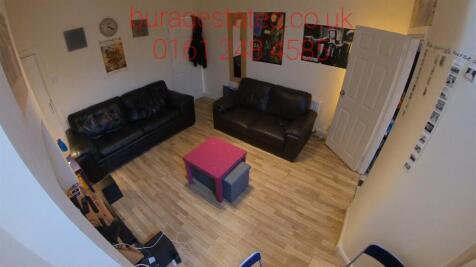 Bright, modern communal living area with two bl...