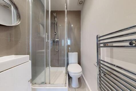 Modern shower room with heated towel rail...