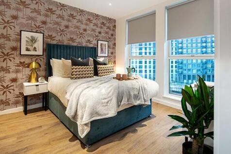 Experience comfort and style in this urban bedroom retreat with stunning city views.