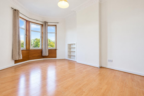 Bright Unfurnished Room with Bay Windows.png