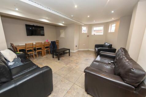 Spacious and well-lit contemporary living room ...