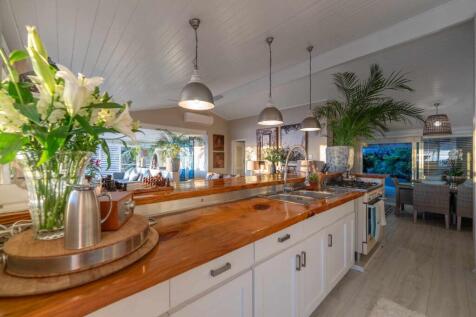 Kitchen, dining area, and back patio/braai area