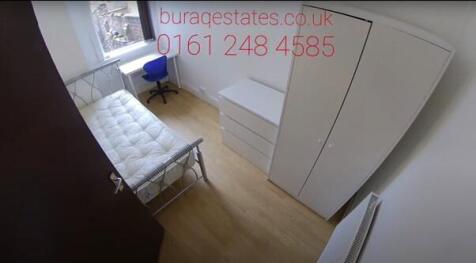 Bright, simply furnished single bedroom with a ...