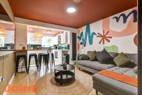 Stylish open-plan living with vibrant mural...