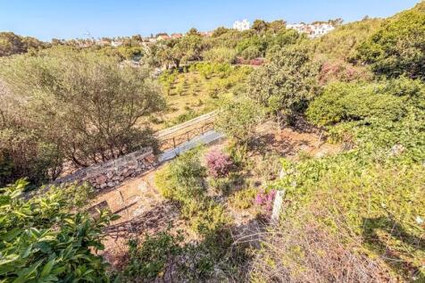 House surrounded by countryside in Cala Santandria