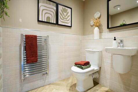A downstairs cloakroom adds convenience