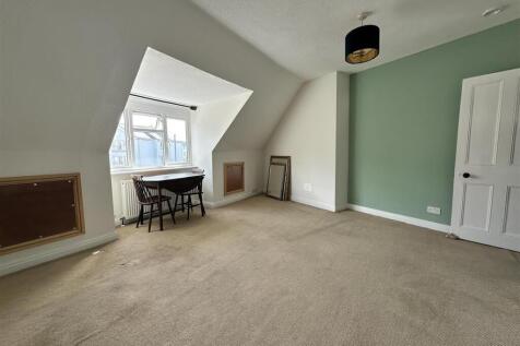 Bright, airy master bedroom with a feature wall...