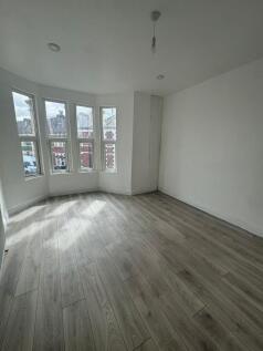 Bright, freshly renovated bedroom with a bay of...