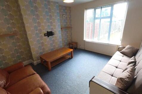 Bright lounge with feature wall and comfy sofas...