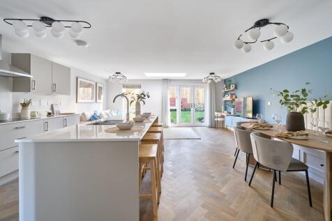 Open plan kitchen and dining area with island