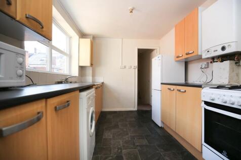 A spacious kitchen with good natural light and ...