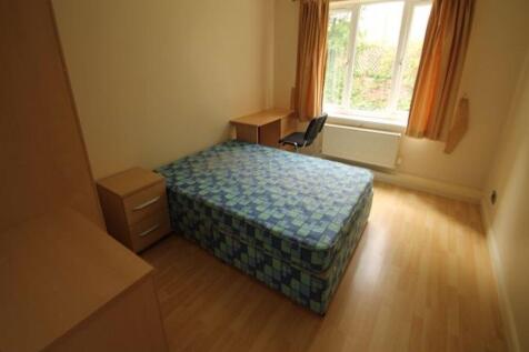Bright and tidy double bedroom featuring a comf...
