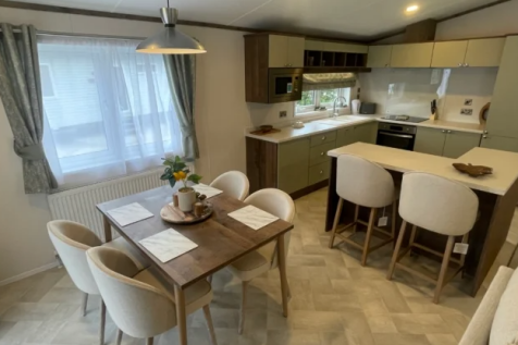 Spacious open plan lounge with vaulted ceilings in