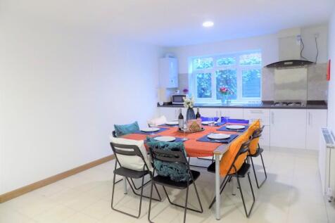 Bright, modern kitchen-diner with a large dinin...