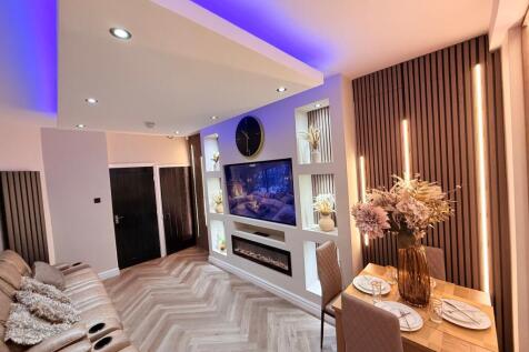 Stylish open-plan living room with a comfy leat...