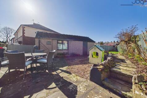 South-West facing Garden with a mixture of lawn and seating areas