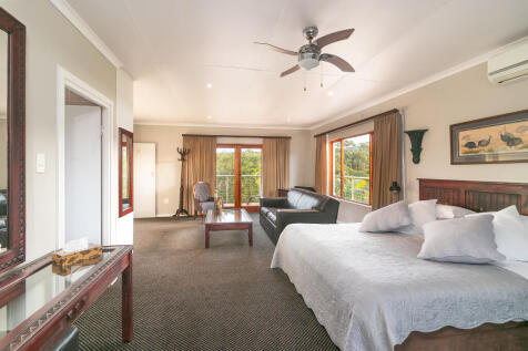 Guest bedroom with large lounge area