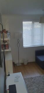 Bright, modern living area with wooden floors, ...